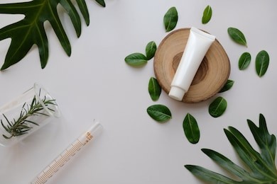 natural organic cosmetic skincare packaging mock up with leaves .bio science beauty concept .blank bottle for branding and label.