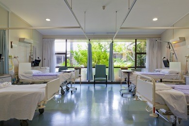 hospital ward with beds and medical equipment