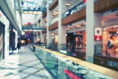 blurred beautiful lobby at the malls. big sales on black friday for christmas. blurred showcases fashion boutique with clothes. bokeh basic background for design                                       
