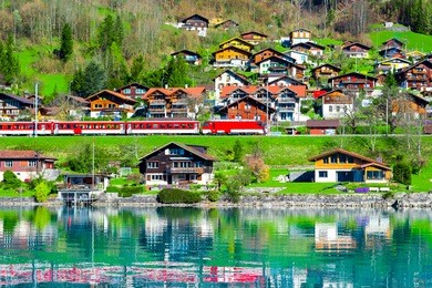 small village with train in lake of interlaken switzerland, the train is running on the lake, view of europe, railway to jungfrau