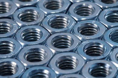 array of shiny metal nuts