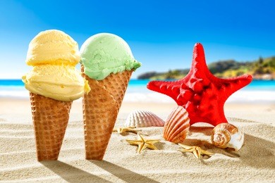ice creams on beach and shells with ocean landscape 