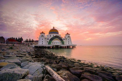 majestic view of malacca straits mosque during sunset.