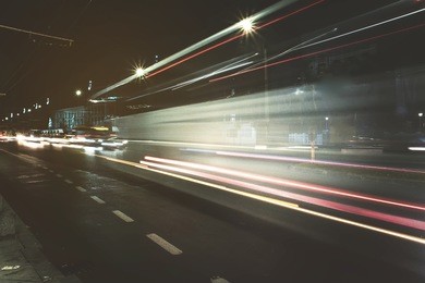 blurred motion long exposure lines light of car headlamps headlights, soft focus . unfocused , speed and fast cars concept in city. traffic jam, public transport image copy space background. 