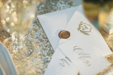 wedding card design. postal card design. sealing wax stamp. golden background.