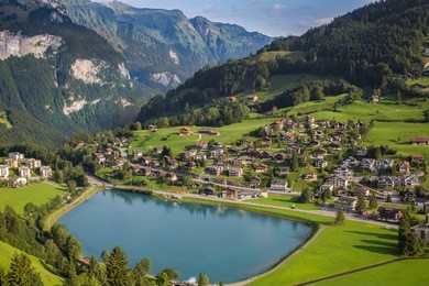 view to engelberg with eugenisee lake under the mt. titlis, switzerland