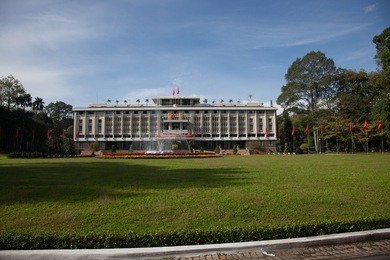reunification palace (the former presidential palace) sits behind a large lawn in ho chi minh city (saigon) vietnam