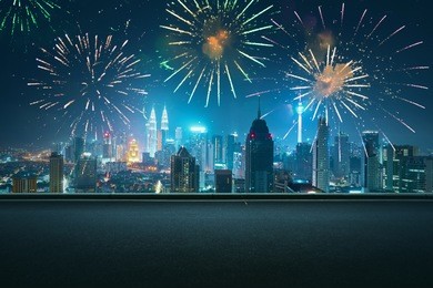 asphalt empty road side with city skyline and firework sky background . night scene with firework celebration .