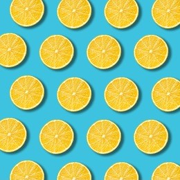 lemon slices pattern on vibrant turquoise color background. minimal flat lay food texture 