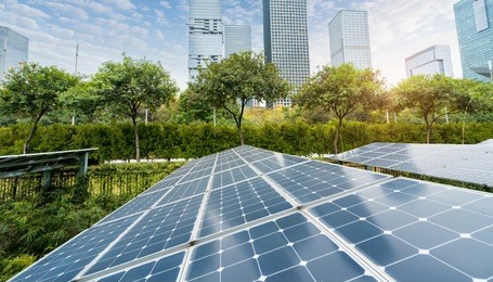 solar panels with cityscape of modern city