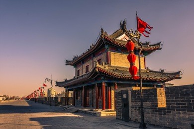 amazing sunset over a temple on the xi'an ancient city walls, china