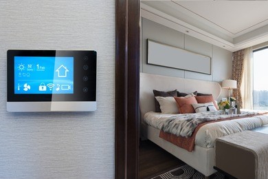 smart home system on intelligence screen on wall and background of modern bedroom