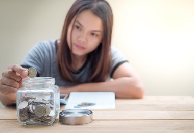 women saving money for future.