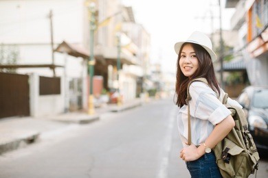 young beautiful female traveler in the city