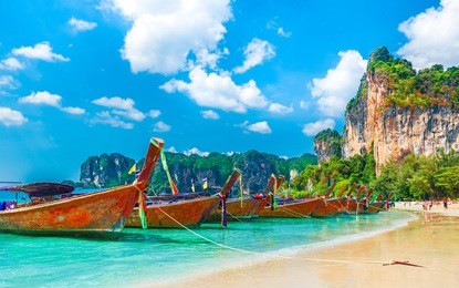 long tail boats on railay beach in krabi region, thailand