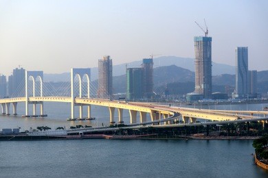 sai van bridge and business building in the morning at macau,china
