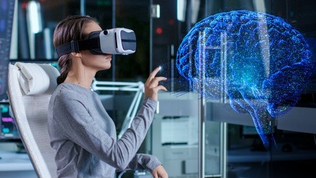 in laboratory scientist wearing virtual reality headset sitting in a chair interacts with brain projection hologram, showing neurological data. modern brain study/ neurological research center.