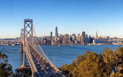 san francisco skyline and bay bridge at sunrise, california