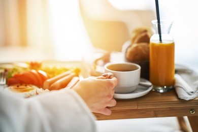 breakfast in bed, cozy hotel room. concept