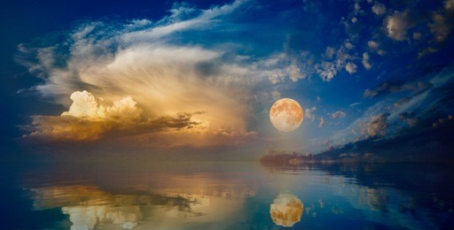 full moon rising above serene sea in sunset sky. elements of this image furnished by nasa