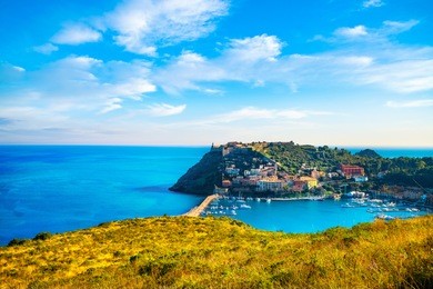 porto ercole village and boats in harbor in a sea bay. aerial view. monte argentario, maremma grosseto tuscany, italy