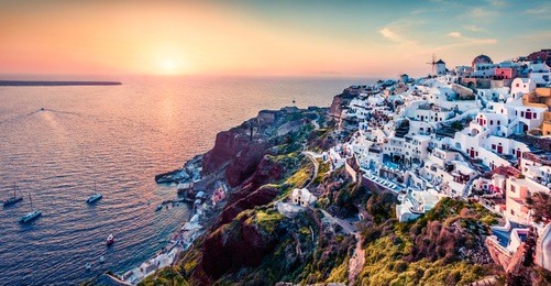 exciting evening view of santorini island. picturesque spring sunset on the famous greek resort oia, greece, europe. traveling concept background. artistic style post processed photo.
