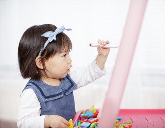 baby girl drawing at home