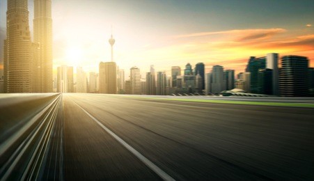 asphalt road of modern city with skyscrapers as background. moti