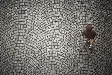 young man is running in rain - blurred motion