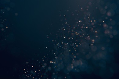 glitter lights abstract background. defocused bokeh dark illustration