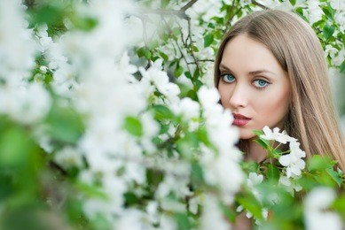 beautiful woman in spring flowers