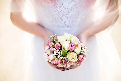 bride holding flowers