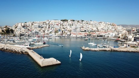 aerial drone bird's eye view photo of iconic round shaped port of mikrolimano with boats docked, piraeus, attica, greece