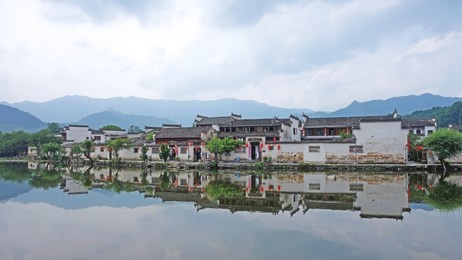 the water reflection of hongcun village in morning. hongcun village, anhui china : one of most attractive ancient village in china.