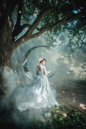 beautiful lady in wedding dress standing near mirror moon. fairytale wedding