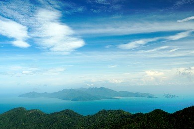 panoramic view of blue sky sea and mountain seen from cable car viewpoint, langkawi, malaysia. picturesque landscape with tropical forest, beaches, small islands in waters of strait of malacca