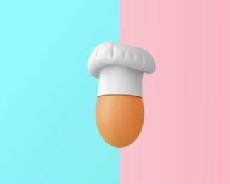 chef hat with egg concept on pastel pink and blue background. minimal idea food and fruit concept. an idea creative to produce work within an advertising marketing communications or artwork design. 