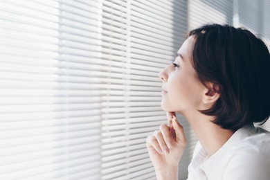 woman relaxing at the window