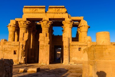 part of the temple of kom ombo dedicated to the crocodile god sobek and the falcon god haroeris, sundown, egypt.