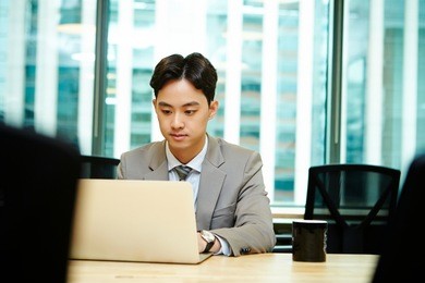 korean businessman working with laptop 
