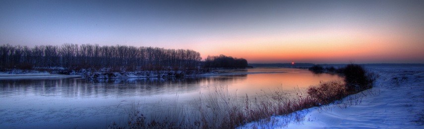 sunrise panoramic hdr view of the river jiu and its frozen valley on the day of winter solstice (shortest day of the year, romania, dolj county).
