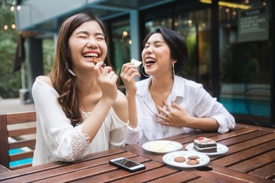young asian female friends taking her vacation in the resort