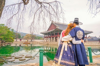 young couple korean dressed hanbok in traditional dress in gyeongbokgung palace seoul korea