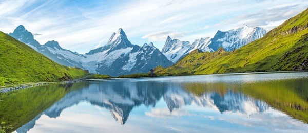 a magical panorama landscape with a lake in the mountains in the swiss alps, europe. wetterhorn, schreckhorn, finsteraarhorn et bachsee. ( relaxation, harmony, anti-stress - concept). 