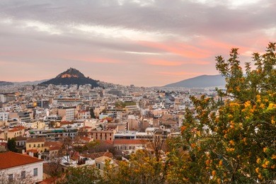 view of lycabettus hill from anafiotika neighborhood in the old town of athens, greece. 
