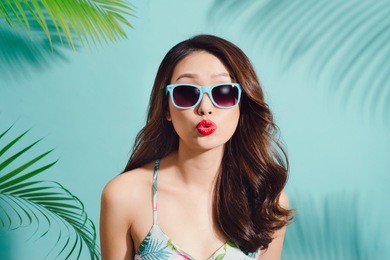 summer fashion portrait of beautiful elegant asian woman posing in summer outfit