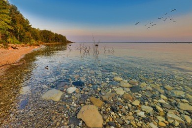 enjoy the view of lake michigan during sunrise and sunset.  this view is between petoskey and charlevoix michigan.