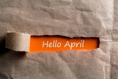 hello april concept. inscription in torn envelope