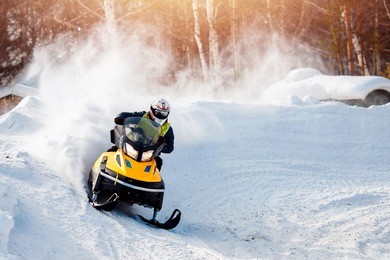 snowmobile. snowmobile races in the snow. concept winter sports, racers.