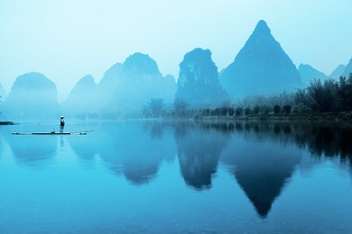 beautiful karst mountain landscape with bamboo raft in yangshuo,guilin,china